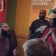 Donald Carter (far left) surprises Shajauna Mays with enough money to cover her tuition for a nursing course and certification. (Matthew Marcus via YouTube screenshot)